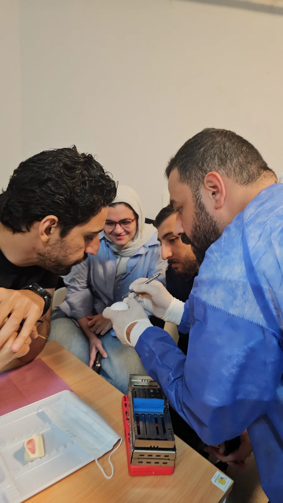 Participants observe a hands-on dental demonstration